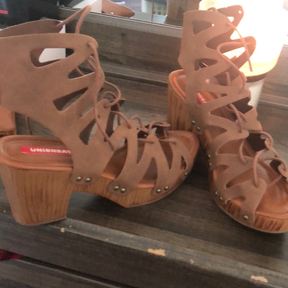 Tan pair of wedge sandals